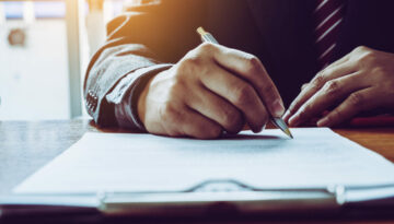 Business man sign a contract investment professional document ag