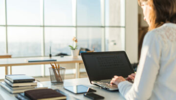 Businesswoman typing on laptop at workplace Woman working in home office hand keyboard